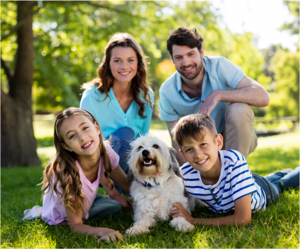 family of four with small dog