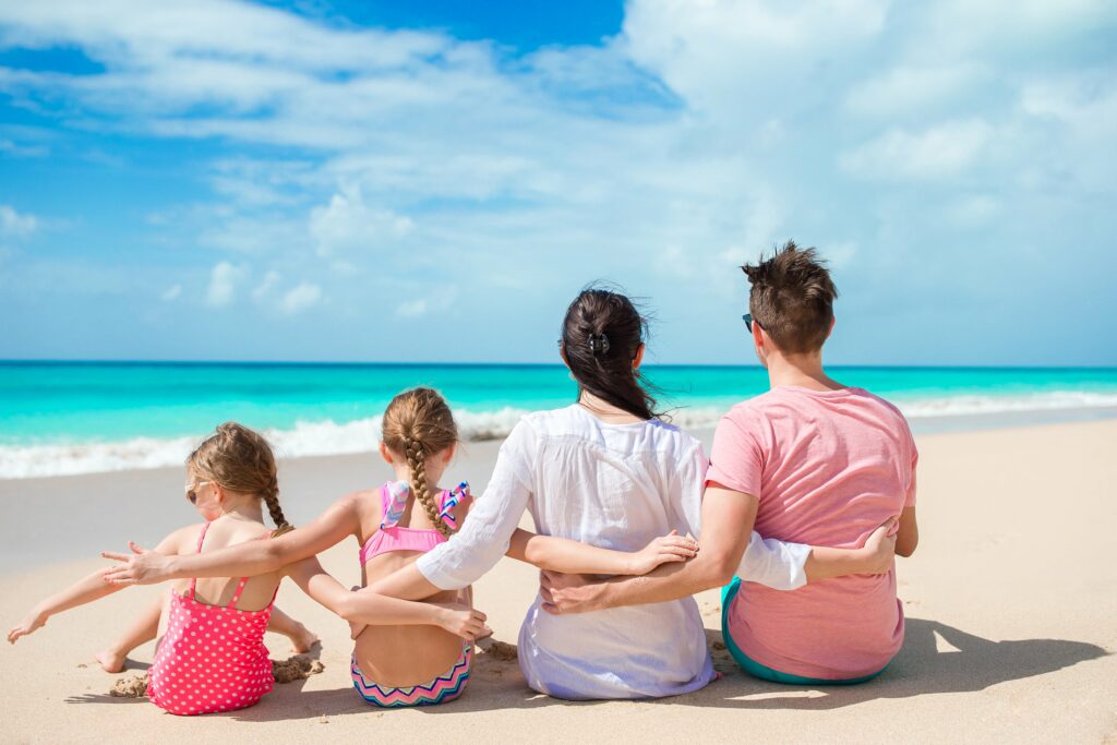 happy-family-with-kids-on-the-beach