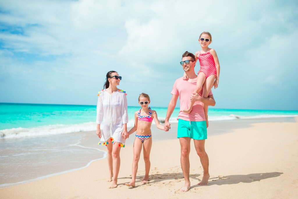 happy-family-with-kids-walk-on-the-beach